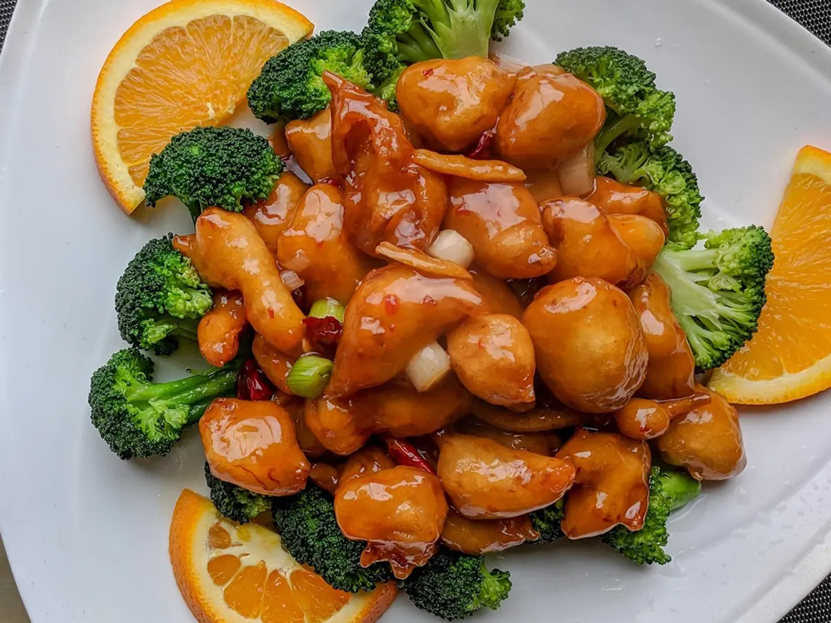 Chinese-American orange chicken with sticky glaze, served over steamed rice at Jade Garden，a Chinese Restaurant in Creston